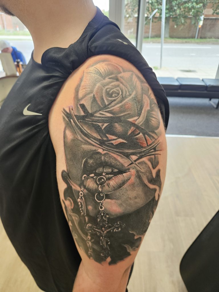 Black and grey tattoo by Wayne Goodwin