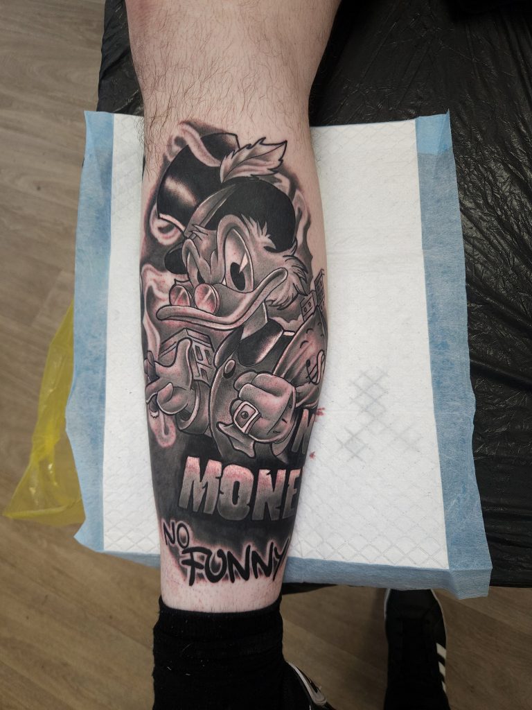 Black and grey tattoo by Wayne Goodwin